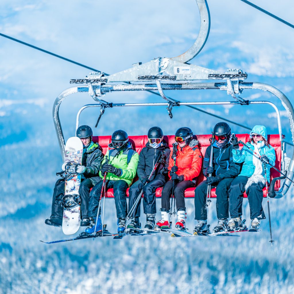 Skiers on the six-seater Ogorjelica chairlift at Jahorina